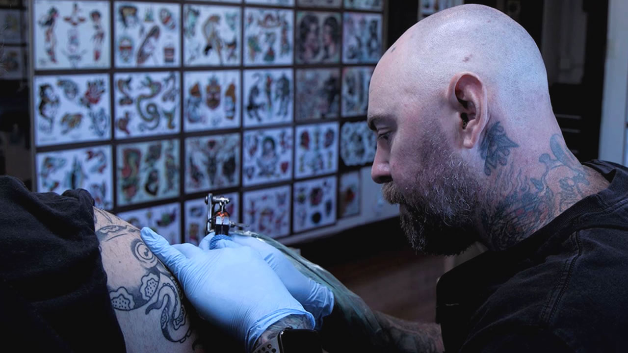 Nick Pulzone of Monolith Tattoo Studio works on Ashley at the 6th annual  Portland tattoo convention held at the Expo Center in Portland, Ore., on  October 12, 2014. (Photo by: Alex Milan