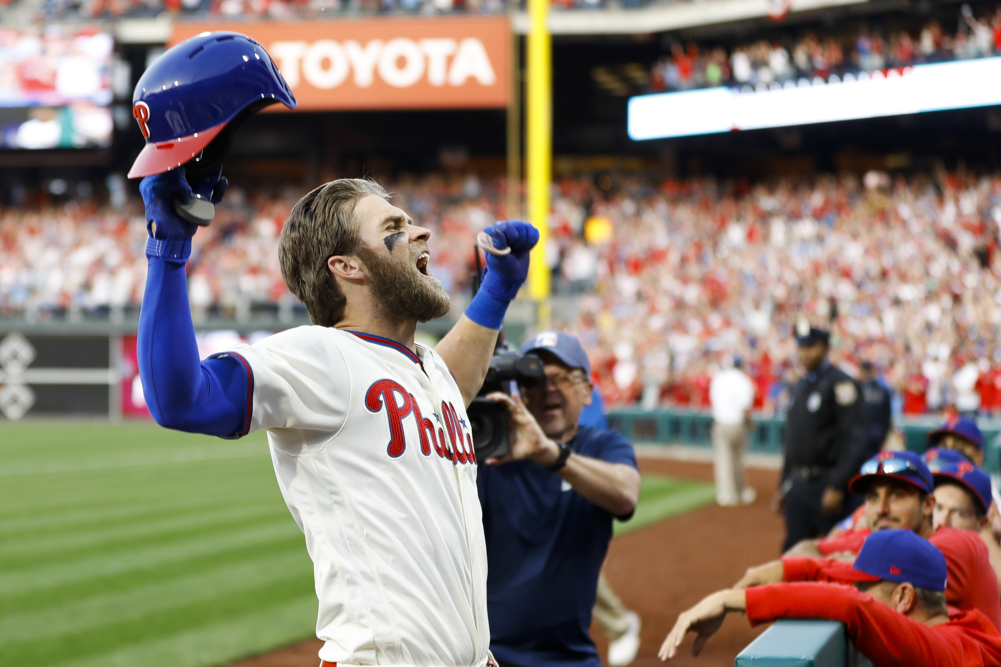 Phillies star Bryce Harper makes catch tumbling into photo pit in first  career start at first base - ABC News